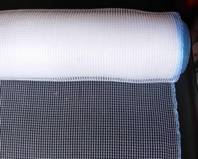 A roll of white plain weave plastic insect screen.