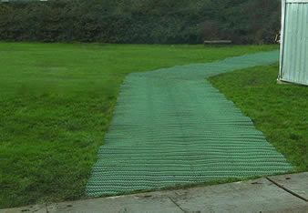 The anti-slip grass protection mesh is covering the grassland to from a pedestrian way.