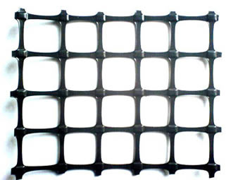 A piece of biaxial plastic geogrid on the white background.