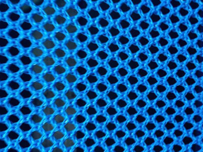 A piece of blue color flexible windbreak netting on the table.