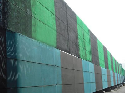 green and black and blue and black flexible windbreak netting is installed on the frame.