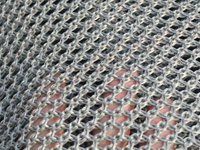 A piece of gray color flexible windbreak netting on the table.