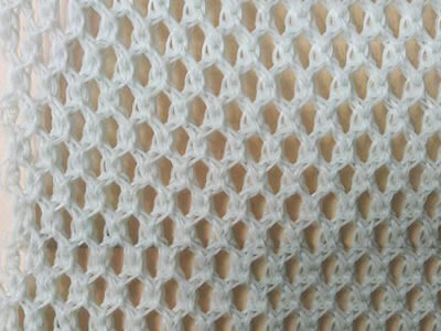 A piece of white color flexible windbreak netting on the table.