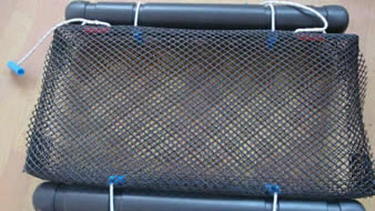 A set of HDPE float oyster mesh bag on the floor.