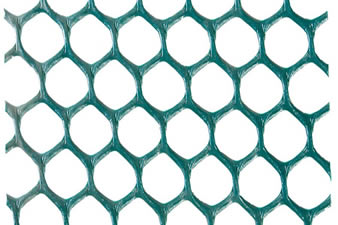 A piece of green hexagonal grass protection mesh on the white background.