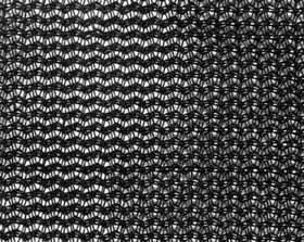 A piece of black heavy knitted windbreak mesh.