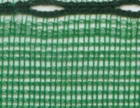 A piece of green medium knitted windbreak mesh. 