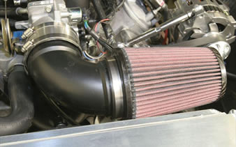 A plastic oriented netting filter is installed on the engine.
