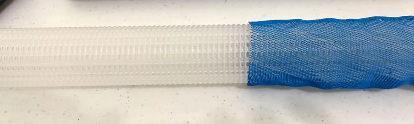 There is one piece of plastic tube netting. It's white