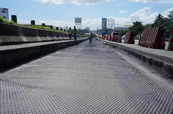 The quaxial plastic geogrid is installed on the paved ground.